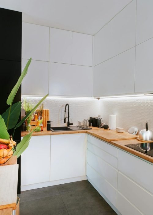 Sleek kitchen featuring smart tech and minimalist design, perfect for modern homes.